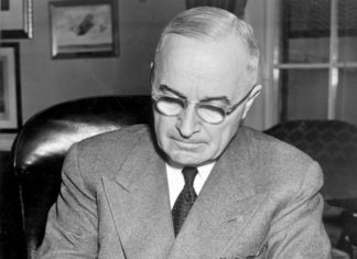 Symposium explores Truman’s health care legacy - Harry S. Truman sitting on a table - Harry S. Truman