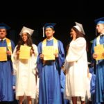 Grads receive awards – Scholarships further seniors’ education goals - A group of people posing for the camera - Graduation ceremony