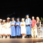 Grads receive awards – Scholarships further seniors’ education goals - A group of people wearing costumes - Alex Mejia