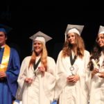 Grads receive awards – Scholarships further seniors’ education goals - A group of people posing for the camera - Graduation ceremony