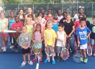 Paradise Tennis bounces on new courts - A group of people posing for a photo - Tennis