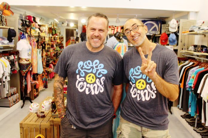“LOVE WINS” designs debut at the Peace Store - A man standing in front of a shop - T-shirt