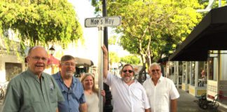 ‘Moe’ honored with street name - A man standing in front of a group of people posing for the camera - Sedan