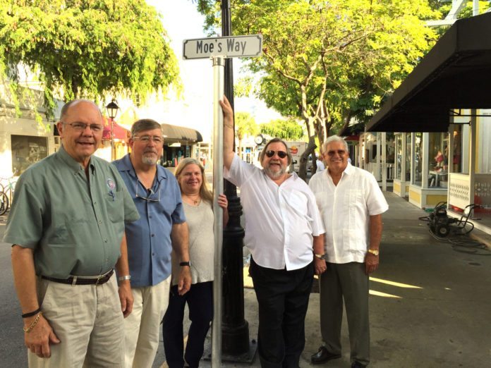 ‘Moe’ honored with street name - A man standing in front of a group of people posing for the camera - Sedan