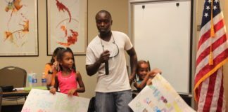 NOAA backs off sandbar rules - A man and a woman standing in a room - Textile