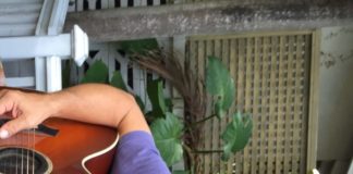 CW Colt changes backyard concert venue - A person holding a guitar - Guitar