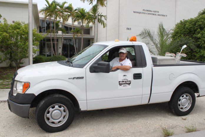 Mosquitoes celebrate – Sanderson retires after 35 years of service - A car parked in front of a truck - Car