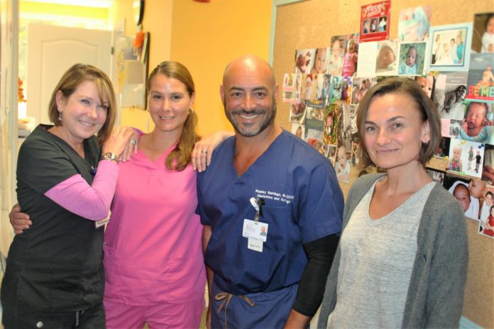 Santiago joins Delong’s Key West practice - A group of people posing for the camera - Santiago Stanley MD