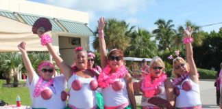 Hundreds join cancer walk - A group of people posing for a picture - Hula