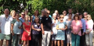 November is Home Health Care and Hospice Month - A group of people posing for a photo - Social group