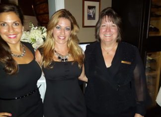 ThanksGIVING supports learning center - A couple of people posing for the camera - Sunset Key Cottages