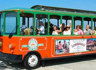 Commission inks ‘trolley’ ordinance - A group of people on a bus - Old Town Trolley Tours Key West