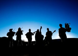 Hackensaw Boys play two KW gigs this weekend - A group of people that are standing in the dark - The Hackensaw Boys - Free Show!