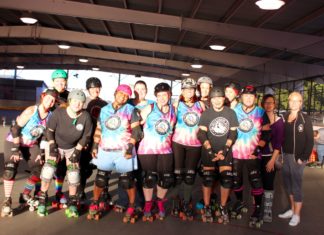 Fall seven times, stand up eight - A group of people posing for the camera - Roller derby