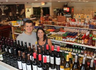 Sparky’s has a sister! - A store filled with lots of glasses of wine - Sparky's Landing