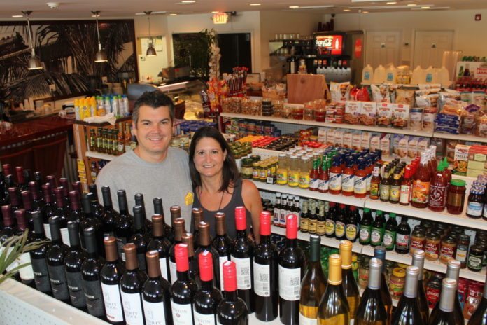 Sparky’s has a sister! - A store filled with lots of glasses of wine - Sparky's Landing