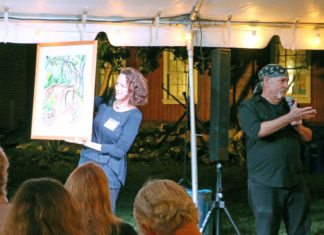 Auction sells the work of local artists Auction sells the work of local artists - A man standing in front of a group of people looking at the camera - Tree