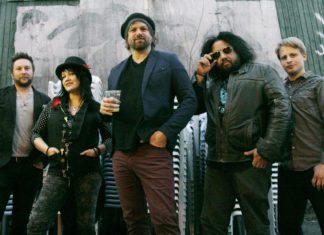 Rusted Root makes Key West debut March 21-22 - A group of people posing for the camera - Patrick Norman