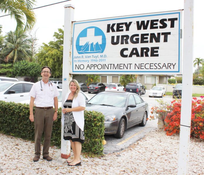Dr. Brian Wagstaff finds his home in Key West - A group of people standing in front of a sign - Wagstaff Brian MD