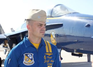 Q&A with a Blue Angel pilot - A man standing in front of a plane - Jeff Kuss