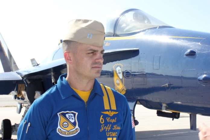 Q&A with a Blue Angel pilot - A man standing in front of a plane - Jeff Kuss