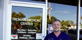 Truman Medical Center accentuates personalized care - A man standing in front of a window posing for the camera - Truman Medical Center Hospital Hill Emergency Room