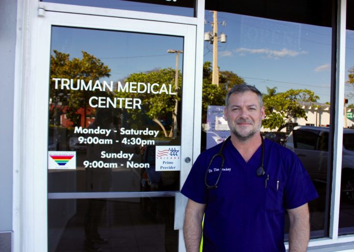 Truman Medical Center accentuates personalized care - A man standing in front of a window posing for the camera - Truman Medical Center Hospital Hill Emergency Room
