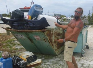 Every day is Earth Day for these guys - A man standing in front of a boat - Key West