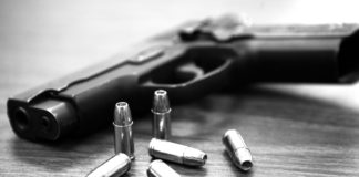 1 of 3: Guns in the Keys - A stack of flyers on a table - Gun violence