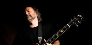 Tinsley Ellis plays at Key West Theater May 12 - A man holding a guitar - Tinsley Ellis