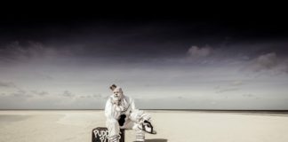 A couple of people that are standing in the sand on a beach - Florida Keys