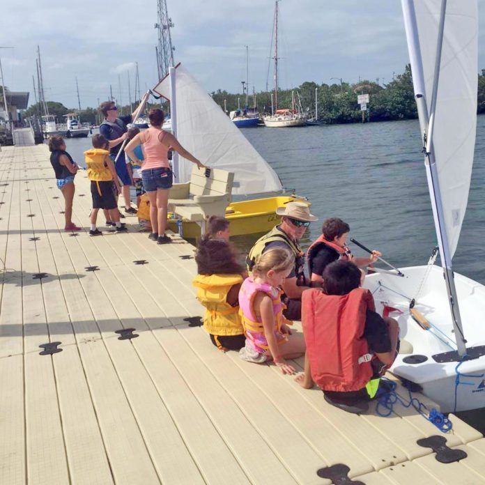 Smooth Sailing: Camp rears new sailors - A group of people on a boat - Sail