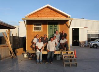 Tiny Homes: Can we do that here? - A group of people standing in front of a house - House