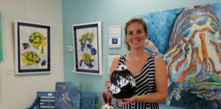 Purple Pumpkins: Art auction and gala raise funds for Rett Syndrome - Michelle Lowe standing in a room - Art
