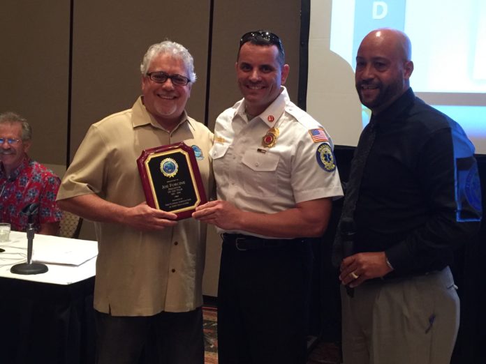High marks: Marathon paramedic presented state award - A group of people holding wine glasses - Marathon Fire Department