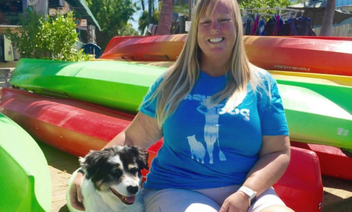 20 Questions with Kathy Gilmour - Alx Danielsson holding a dog in a car - Florida Keys
