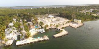 A small boat in a body of water - Water transportation