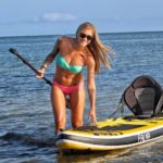 You “CAN” Buy Me Love Date Auction - A woman standing next to a body of water - Sea kayak