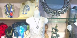 Maki: THE DRESS CODE - A bunch of items that are on display in a store - Gown