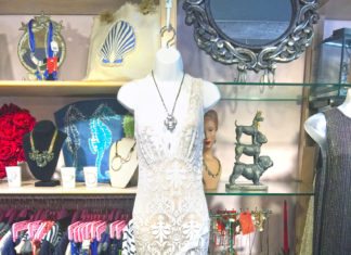 Maki: THE DRESS CODE - A bunch of items that are on display in a store - Gown