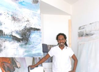 Indefinable Worlds: Exhibit opens at The Studios Indefinable Worlds: Exhibit opens at The Studios - A person standing posing for the camera - Painting