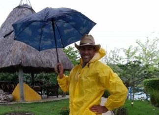 20 Questions with Kevin Johnsen - A man holding a yellow umbrella - Leisure