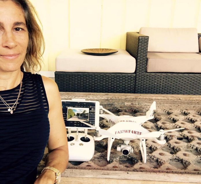 DRONE PRO: Upper Keys photographer’s business is flying - A woman posing for a picture - Pattern