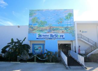 The ReStore needs a new home - A sign on the side of a building - Condominium