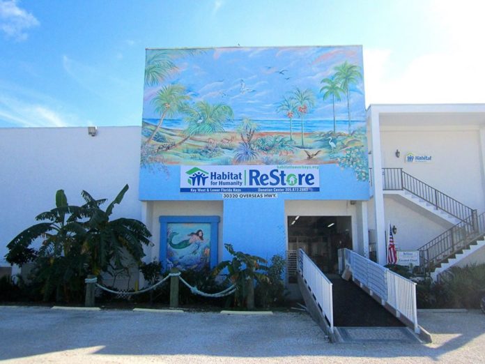 The ReStore needs a new home - A sign on the side of a building - Condominium