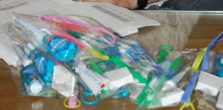 Dental care rolls through the Upper Keys - A cluttered desk with a laptop computer sitting on top of a table - Plastic