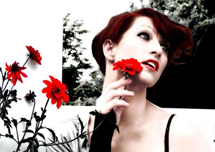 Revisionist Art: Concert & Book Signing at TSKW - Amanda Palmer wearing a red flower in her hair - The Art of Asking