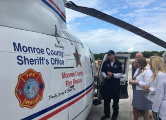 New Trauma Star Air Ambulance approved - A group of people standing in front of a sign - Aviation