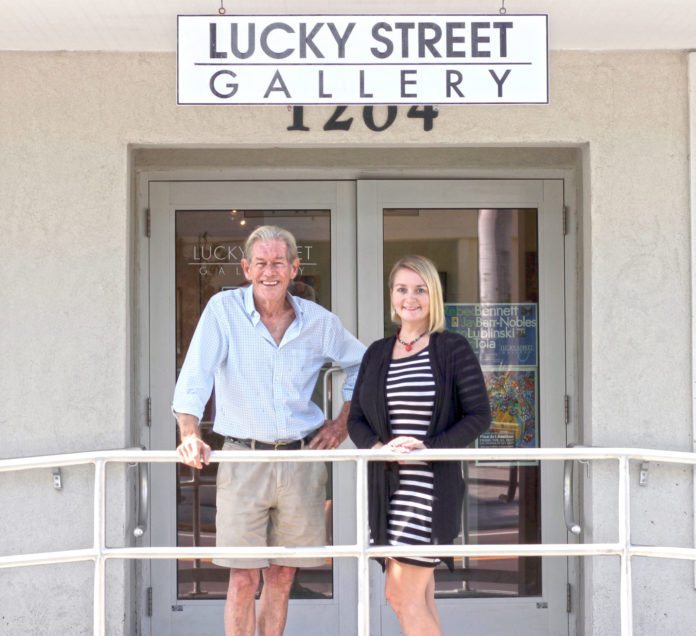 Key West: Still Lucky after 35 years - A man and a woman standing in front of a building - Lucky Street Gallery