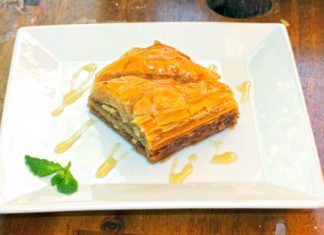 Key West goes Mediterranean - A piece of cake sitting on top of a wooden table - Treacle tart